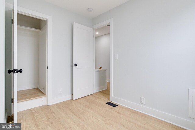 unfurnished bedroom featuring light hardwood / wood-style floors