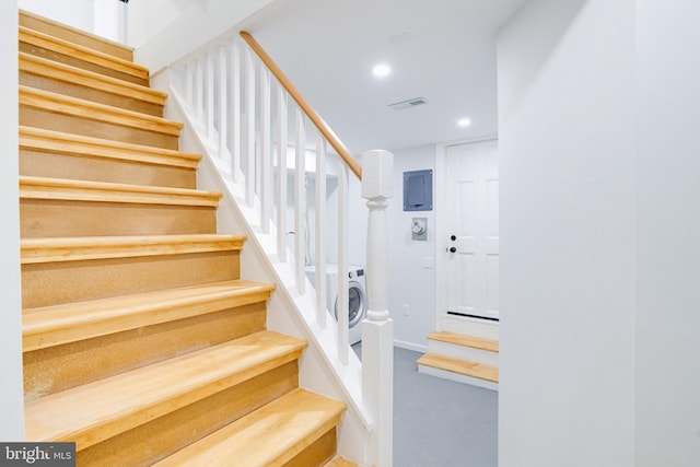 stairway with washer / clothes dryer