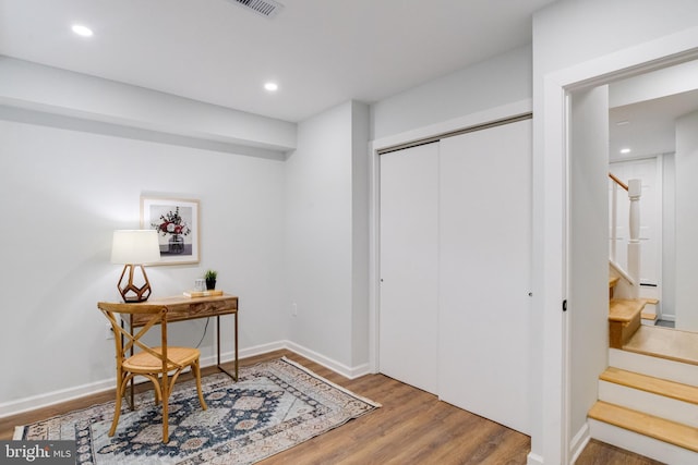 entryway with hardwood / wood-style floors