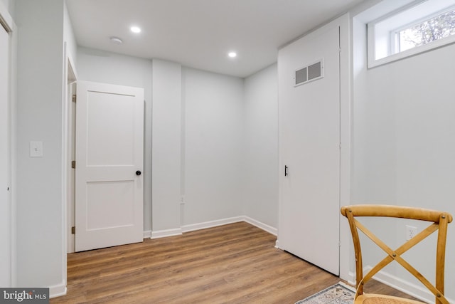 hallway featuring hardwood / wood-style flooring