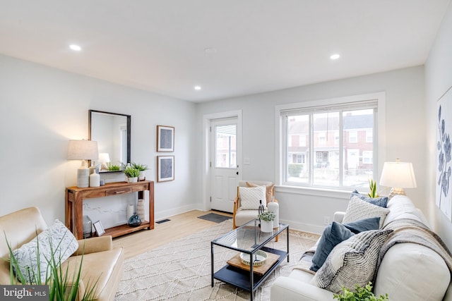 living room with light hardwood / wood-style floors