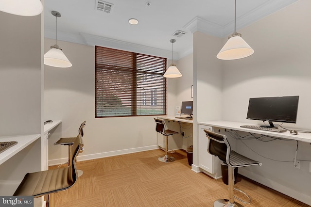 home office with crown molding and built in desk