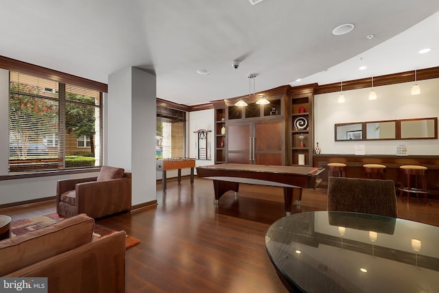 rec room featuring pool table, dark wood-type flooring, and ornamental molding