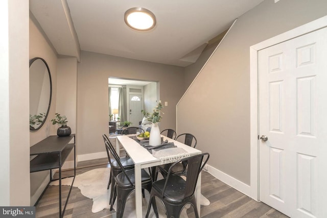 dining space with dark hardwood / wood-style floors