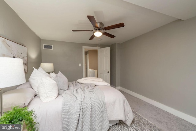 bedroom featuring ceiling fan and carpet