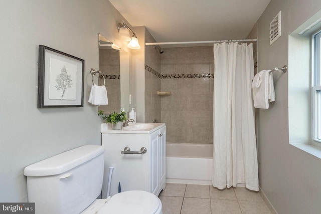 full bathroom featuring vanity, toilet, tile patterned flooring, and shower / bath combo