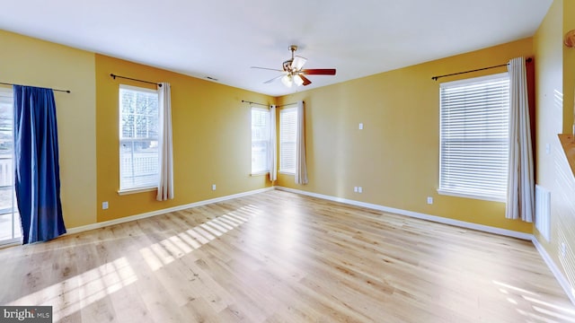 empty room featuring light hardwood / wood-style floors and ceiling fan