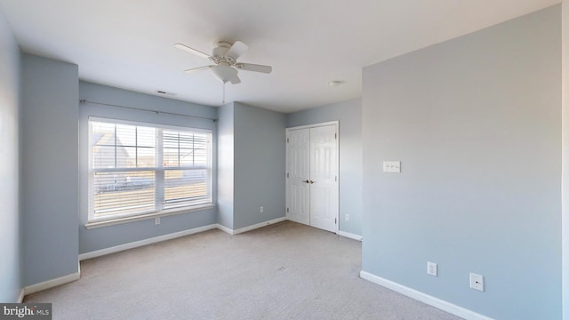 carpeted empty room with ceiling fan