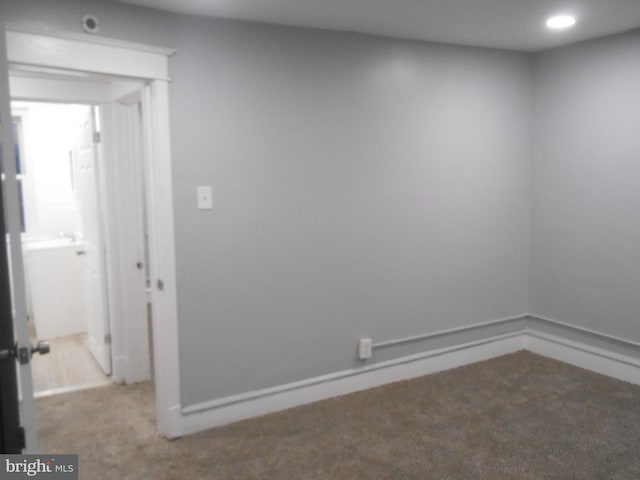 empty room featuring carpet flooring