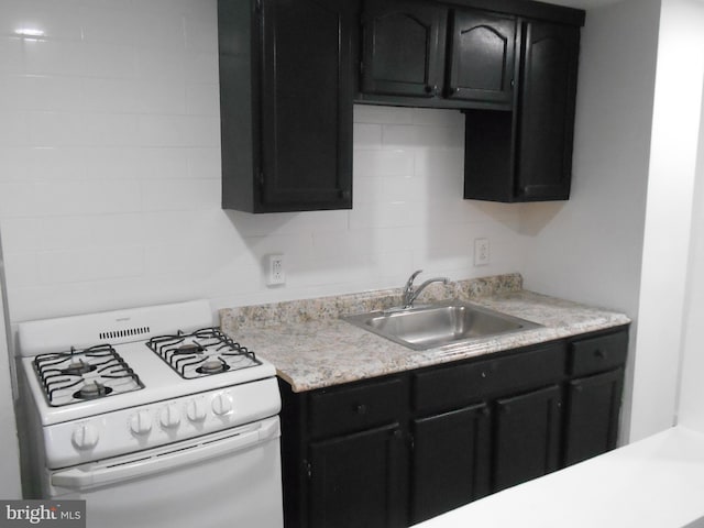 kitchen with sink and gas range gas stove