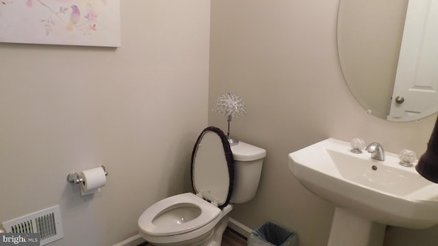 bathroom with toilet and sink