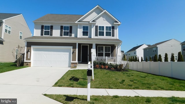 view of front of house featuring a porch, a garage, and a front yard