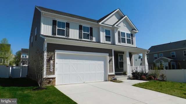 craftsman-style house with a garage and a front yard