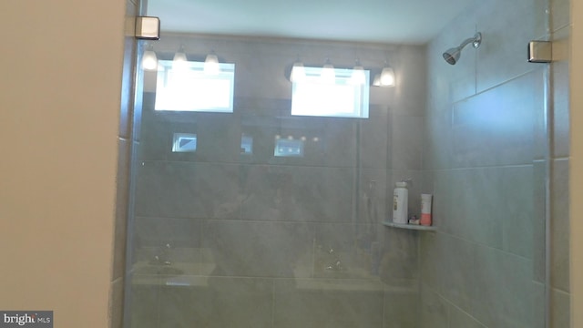 bathroom with a tile shower