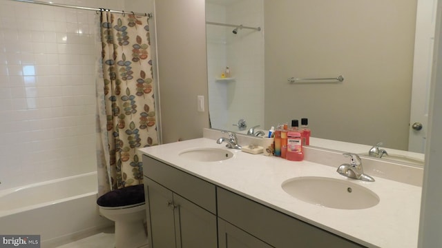 full bathroom with vanity, toilet, and shower / bath combo with shower curtain