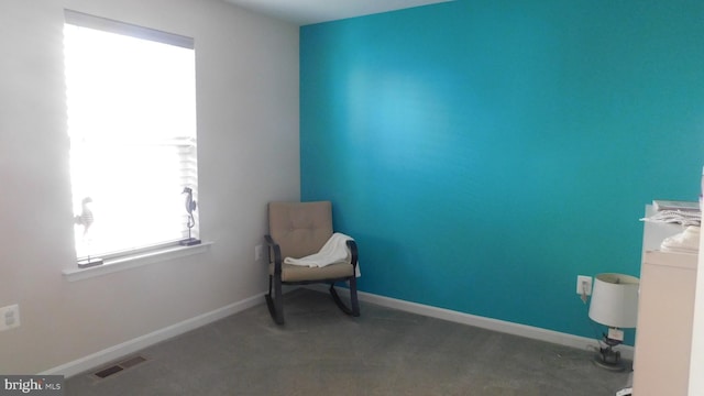 unfurnished room featuring carpet flooring