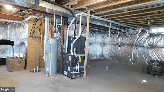 basement with water heater and heating unit