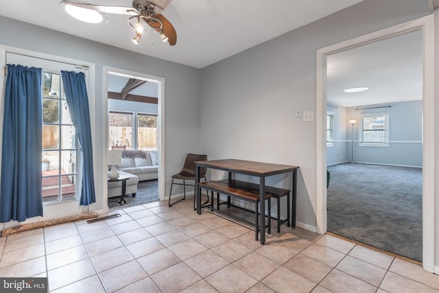 tiled dining room with ceiling fan