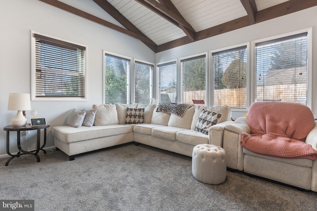 carpeted living room featuring vaulted ceiling with beams