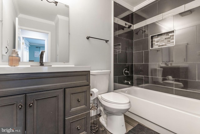 full bathroom featuring tiled shower / bath combo, crown molding, vanity, and toilet