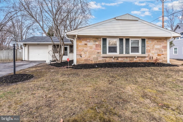 view of front facade with a garage and a front lawn