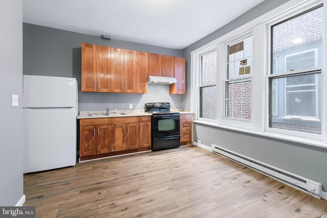 kitchen with a baseboard radiator, sink, white refrigerator, light hardwood / wood-style floors, and black / electric stove