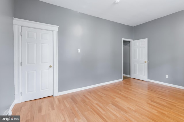 spare room with light wood-type flooring