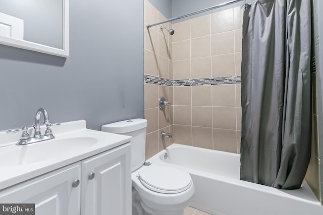 full bathroom with vanity, shower / bath combo, and toilet