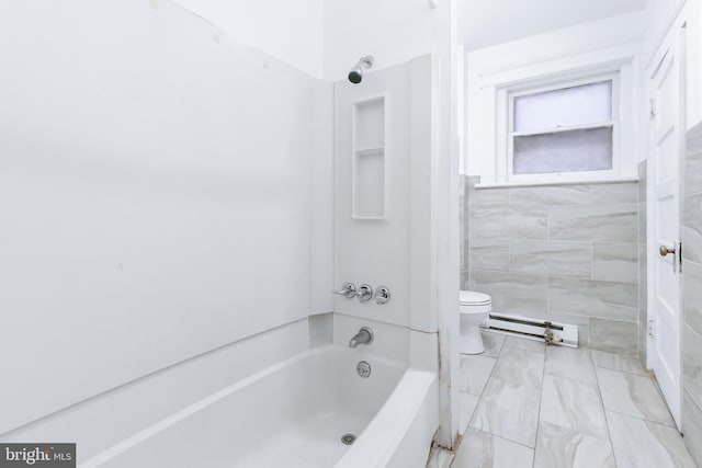 bathroom with tile walls, a baseboard radiator, toilet, and shower / bathing tub combination