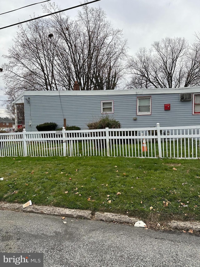 view of home's exterior featuring a yard