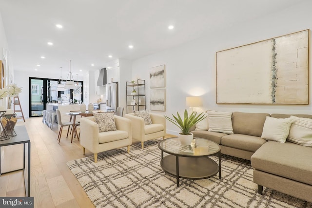 living room with light hardwood / wood-style flooring