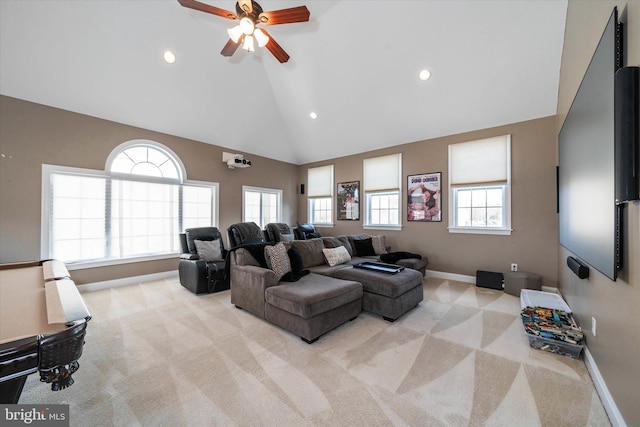 cinema featuring high vaulted ceiling, light colored carpet, and ceiling fan