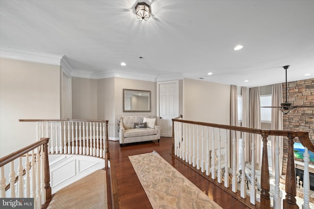 hall with ornamental molding and dark hardwood / wood-style floors