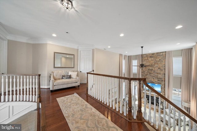 corridor with crown molding and dark hardwood / wood-style flooring