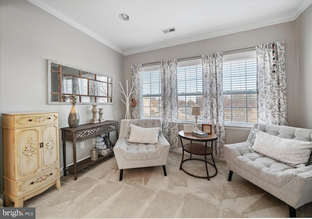 sitting room with light carpet, crown molding, and a healthy amount of sunlight