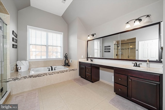 bathroom with vanity, tile patterned flooring, vaulted ceiling, and plus walk in shower