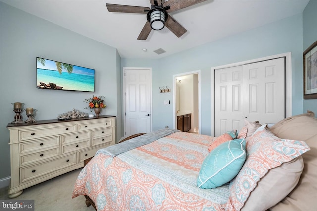 carpeted bedroom featuring connected bathroom, a closet, and ceiling fan