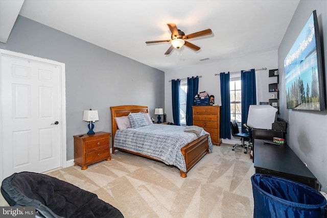 bedroom featuring light colored carpet and ceiling fan