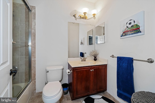 full bathroom with vanity, an inviting chandelier, shower / bath combination with glass door, and toilet