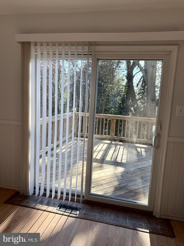 doorway to outside featuring hardwood / wood-style flooring