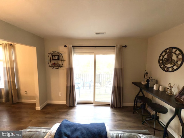 living room with dark hardwood / wood-style floors