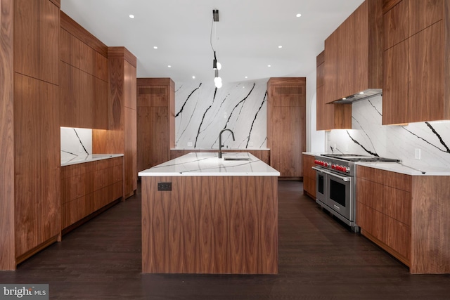 87 Library Pl, Princeton, NJ 08540 - kitchen featuring modern cabinets, double oven range, a sink, a center island with sink, and recessed lighting