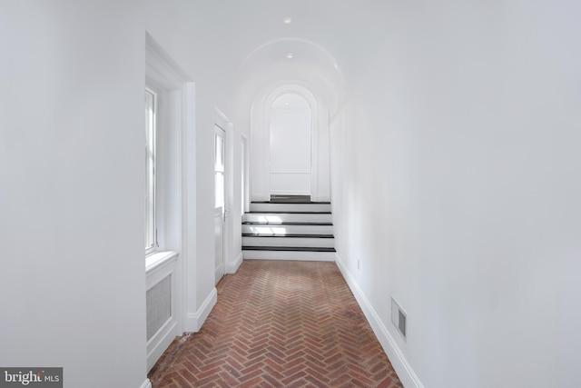 87 Library Pl, Princeton, NJ 08540 - corridor with brick floors, stairway, and baseboards
