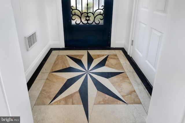 87 Library Pl, Princeton, NJ 08540 - doorway to outside with inlaid floor details and baseboards