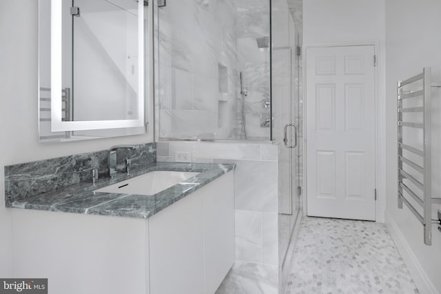 87 Library Pl, Princeton, NJ 08540 - full bathroom featuring radiator heating unit, a shower stall, a towel warming rack, and vanity