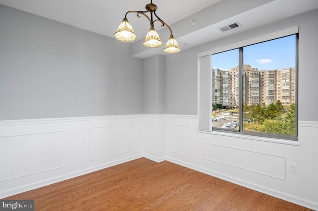 unfurnished room featuring hardwood / wood-style floors