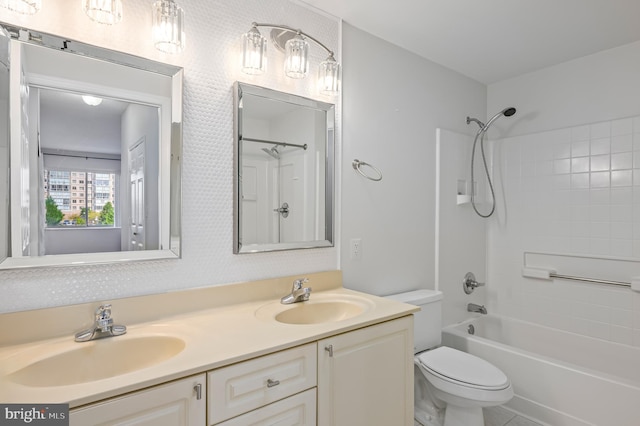 full bathroom featuring vanity, shower / washtub combination, and toilet