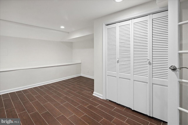 basement featuring dark hardwood / wood-style floors