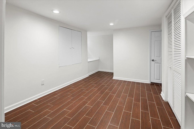 basement featuring dark hardwood / wood-style floors