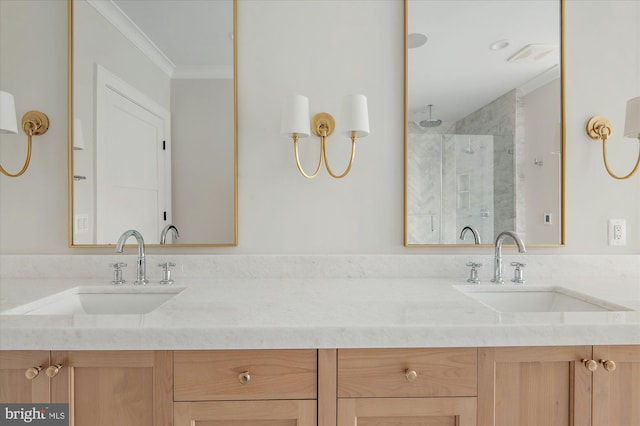 bathroom featuring vanity, a shower with shower door, and ornamental molding